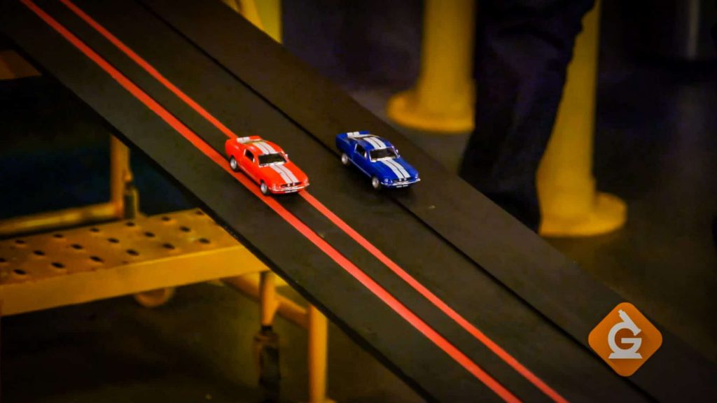 toy cars race to demonstrate friction