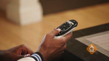 closeup of man holding a remote control