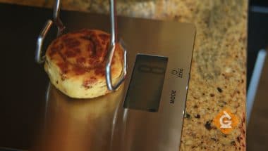 weighing food on a scale to compare the weight before and after