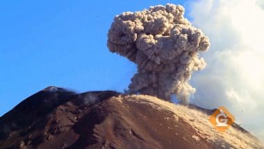 volcano erupting with a cloud of dust 