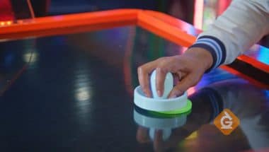 air hockey table with puck on top