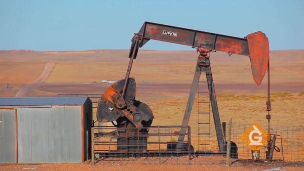 oil rig in desert pumps out oil