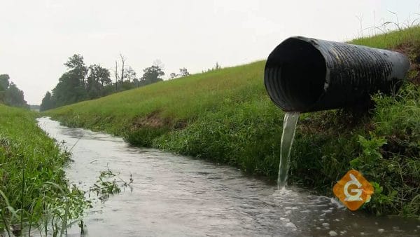 sewage drains into a clean river
