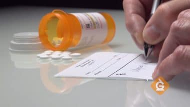 doctor writing a prescription for medicine
