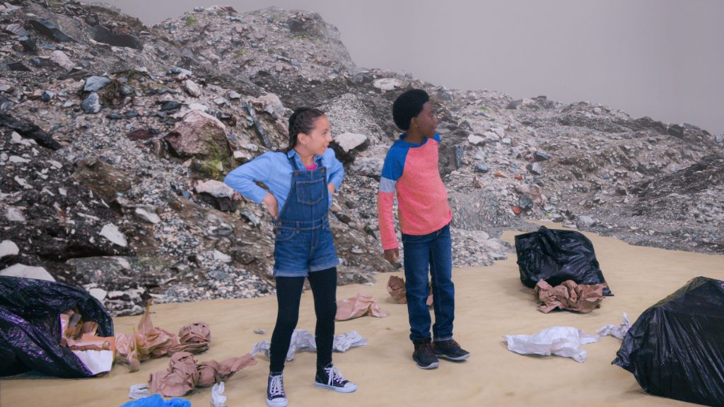 kids explore a garbage dump on a school trip
