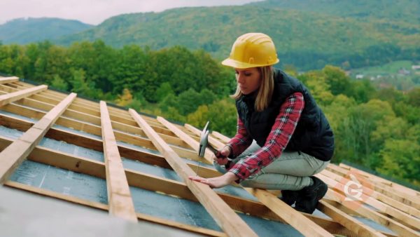 woman uses strong wood to build a house
