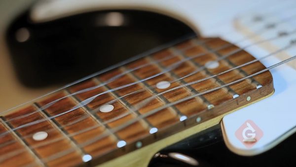 guitar strings vibrate generating sounds