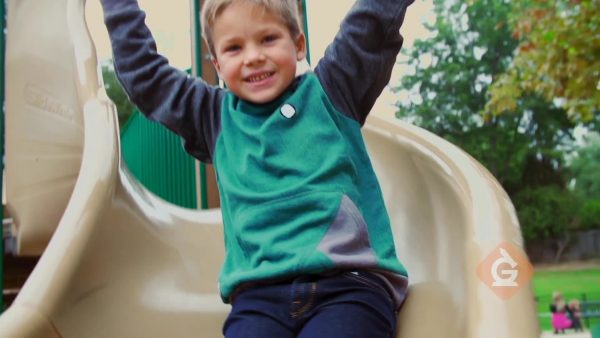 child slides down a slide