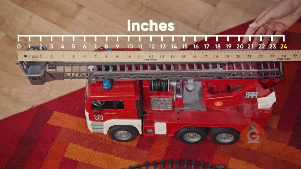 Use a yardstick to measure toy firetrucks.